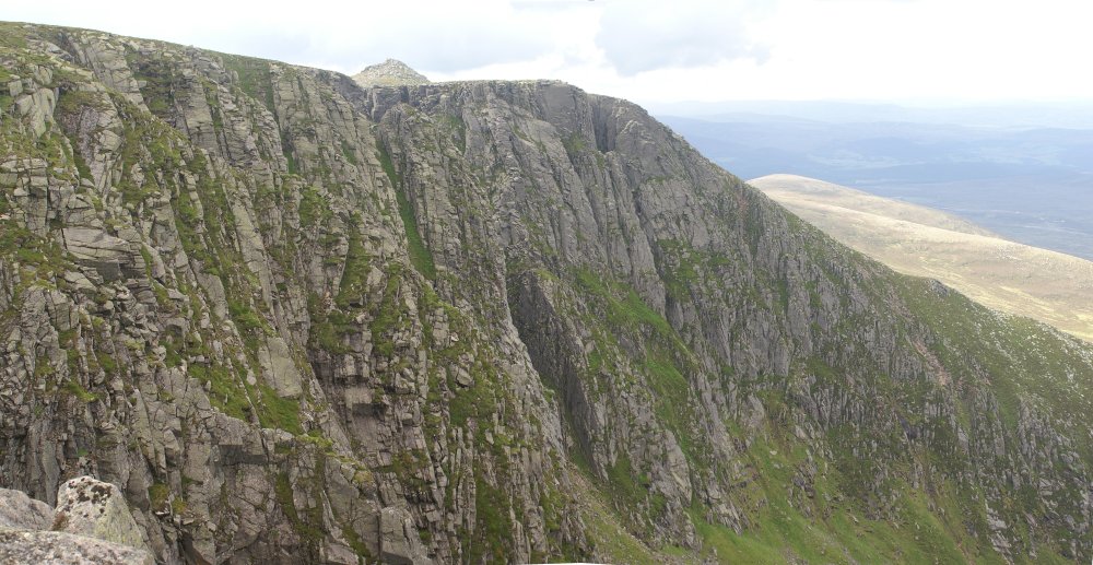 Looking West at the cliff, with the summit in the background