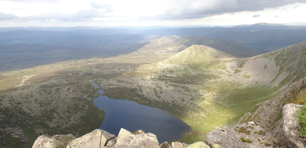 Looking down at the Lochan below the cliff