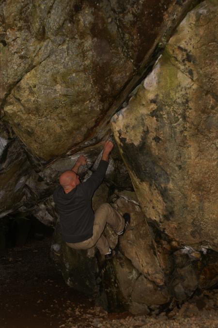 Rick climbing up the Bowder Stone