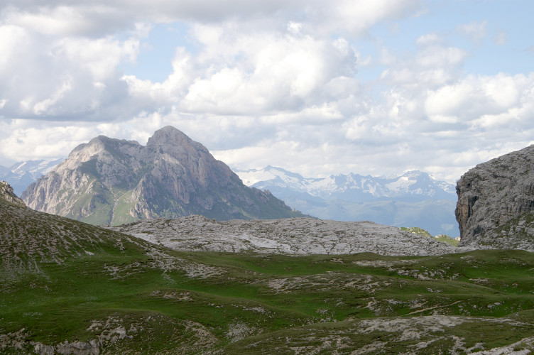 Limestone paving with proper snow-covered mountains in the distance