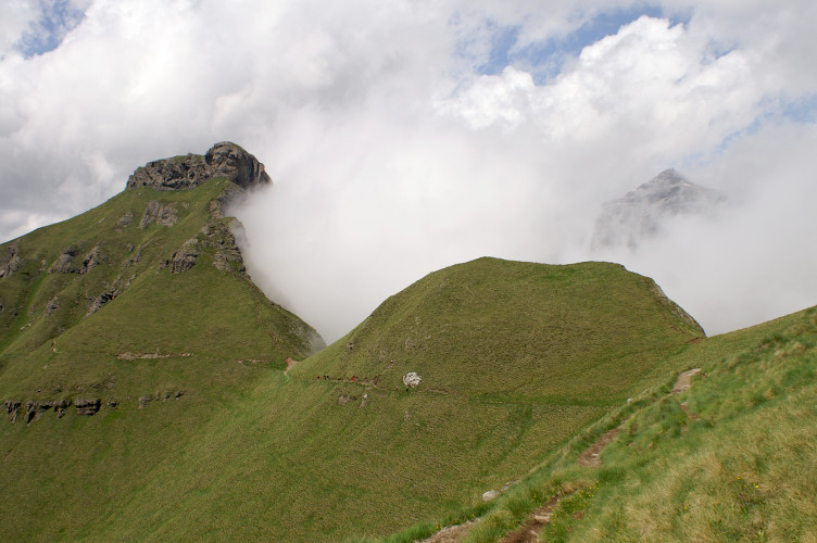 the mist behind a gap in the ridge